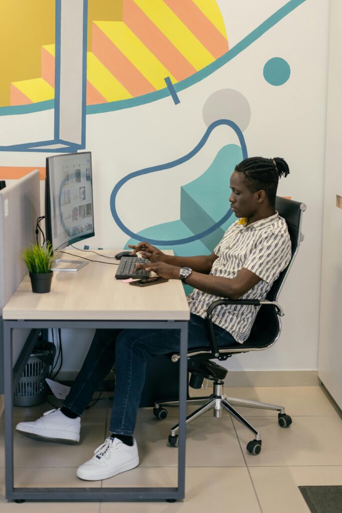 High-Performance Hosting for Nigeria SaaS Companies 1 saas software development as a man work on a computer